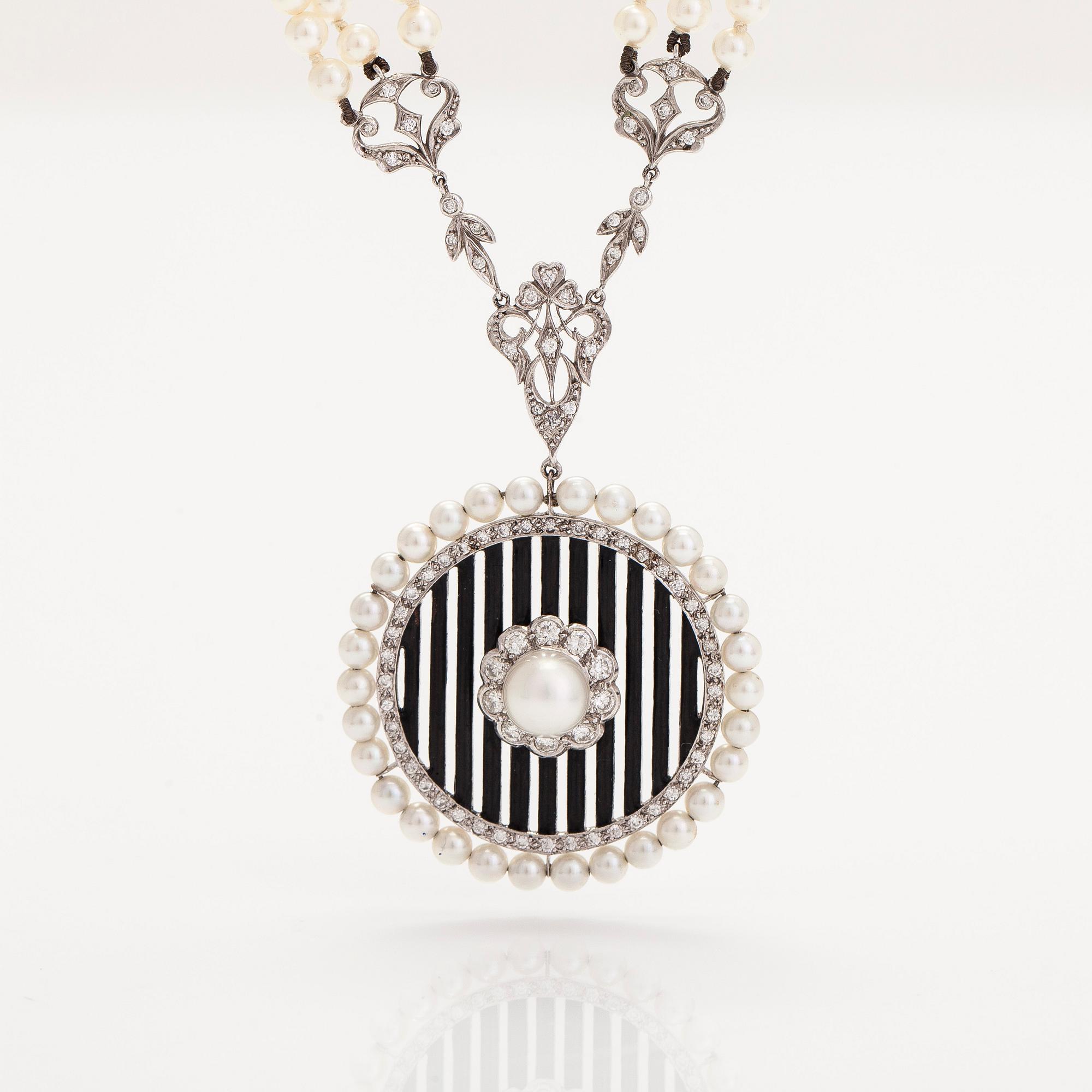 An 18K white gold necklace with cultured pearls, enamel and brilliant-cut diamonds. England.
