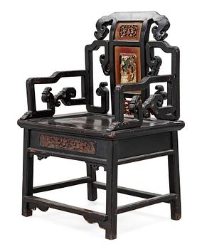1678. A black and red lacquered wooden chair, Qing dynasty.
