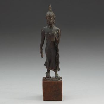 A walking Thai bronze figure of buddha, 19th Century or older.