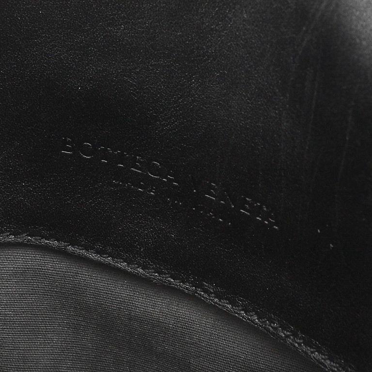 Bottega Veneta, a black intrecciato leather briefcase.