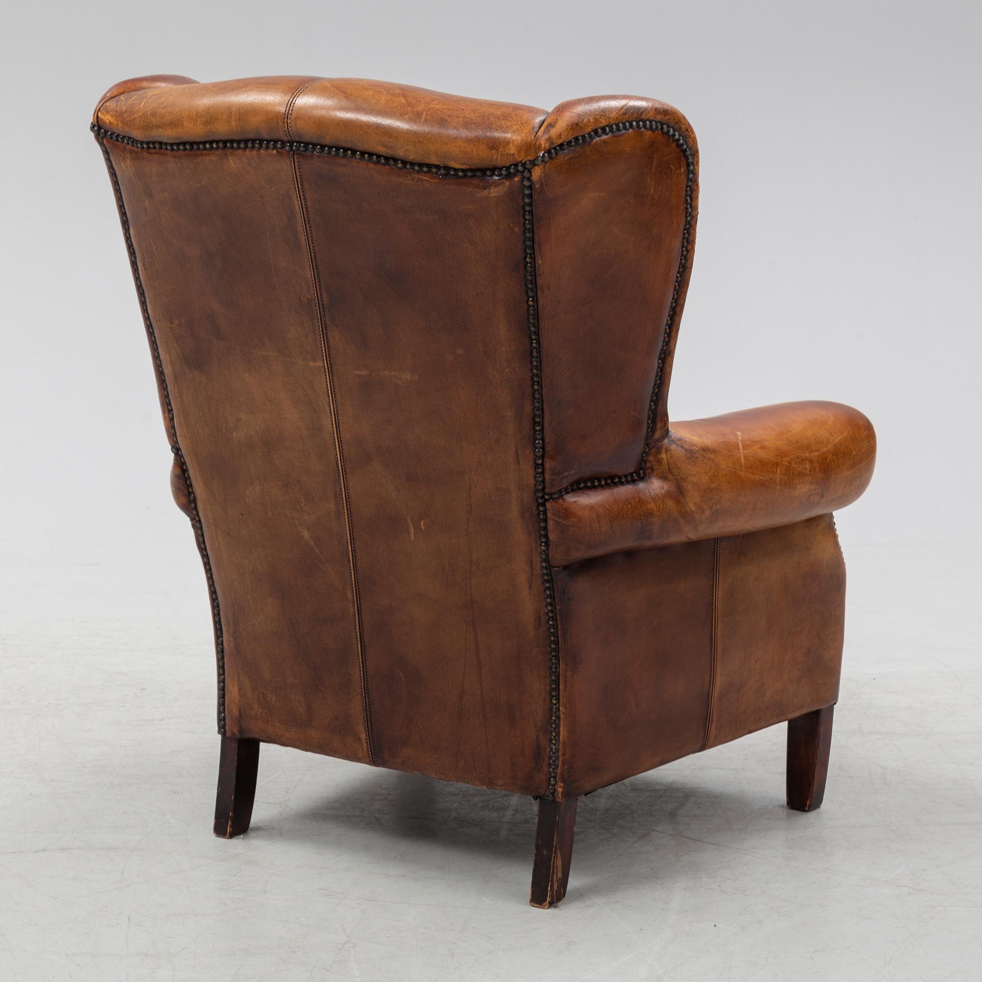 A leather upholstered easy chair , second half of the 20th Century.