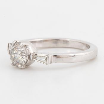 A 14K gold ring set with a round brilliant-cut diamond.