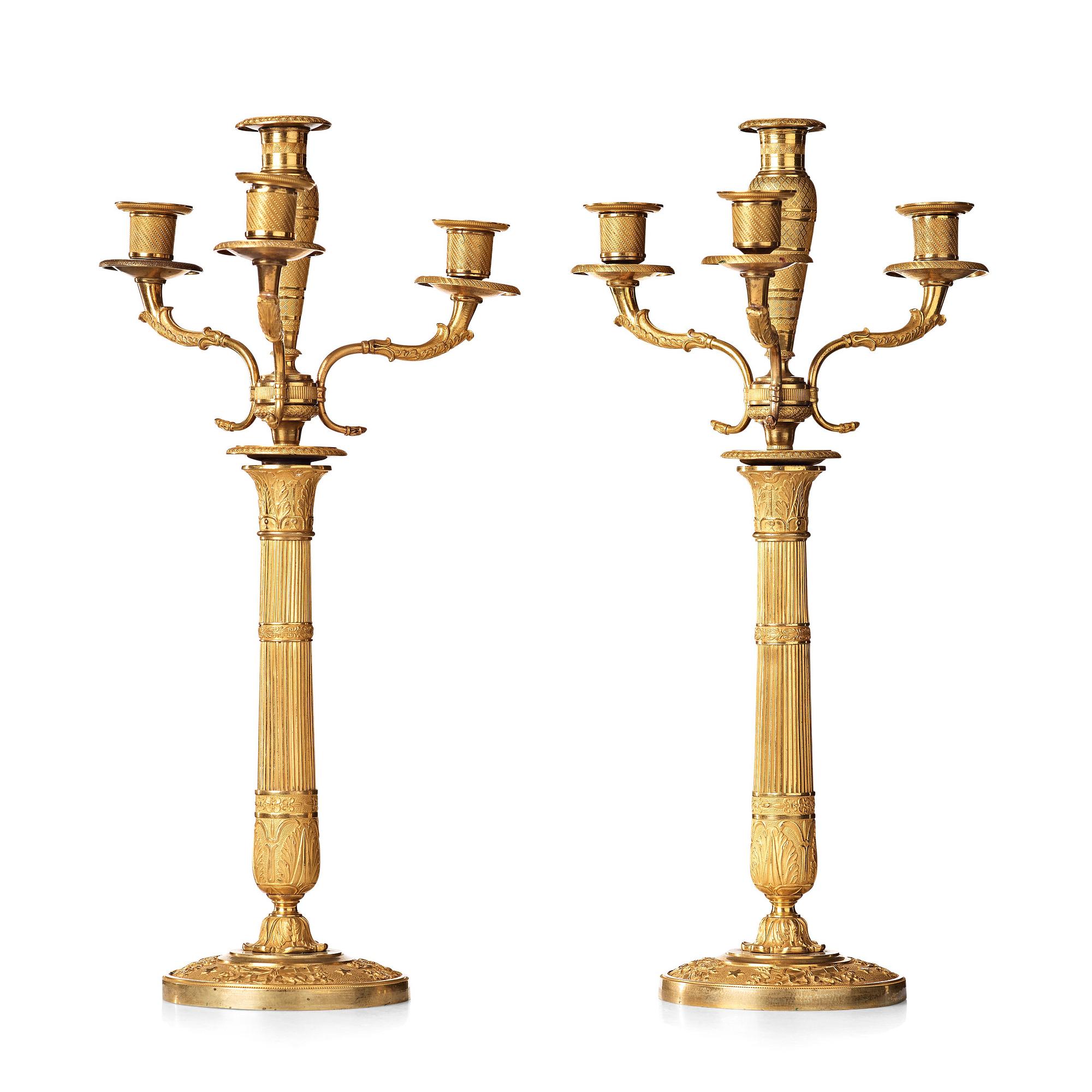 A pair of Empire early 19th century gilt bronze four-light candelabra.