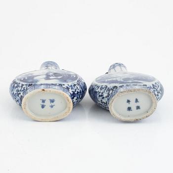 Two blue and white Chinese moonflasks, Qing dynasty, 19th century.