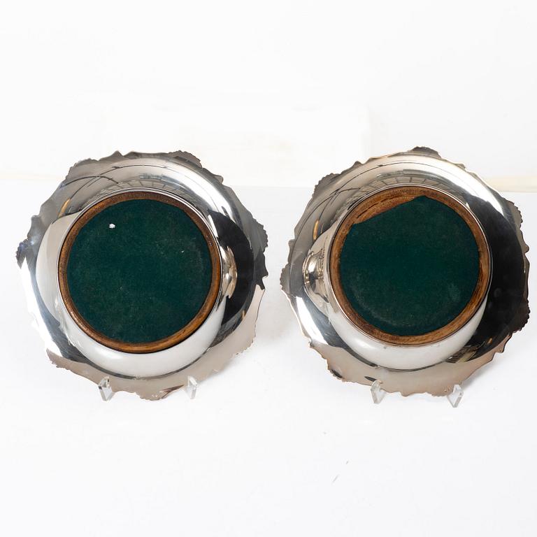 A pair of silver plated coasters, England 20th century.
