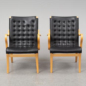 A pair of 'Mina' chairs designed by Bruno Mathsson, Bruno Mathsson International, Värnamo, Sweden.