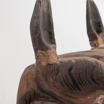 Four Tibetan/South East Asian wooden decorations, 20th century.