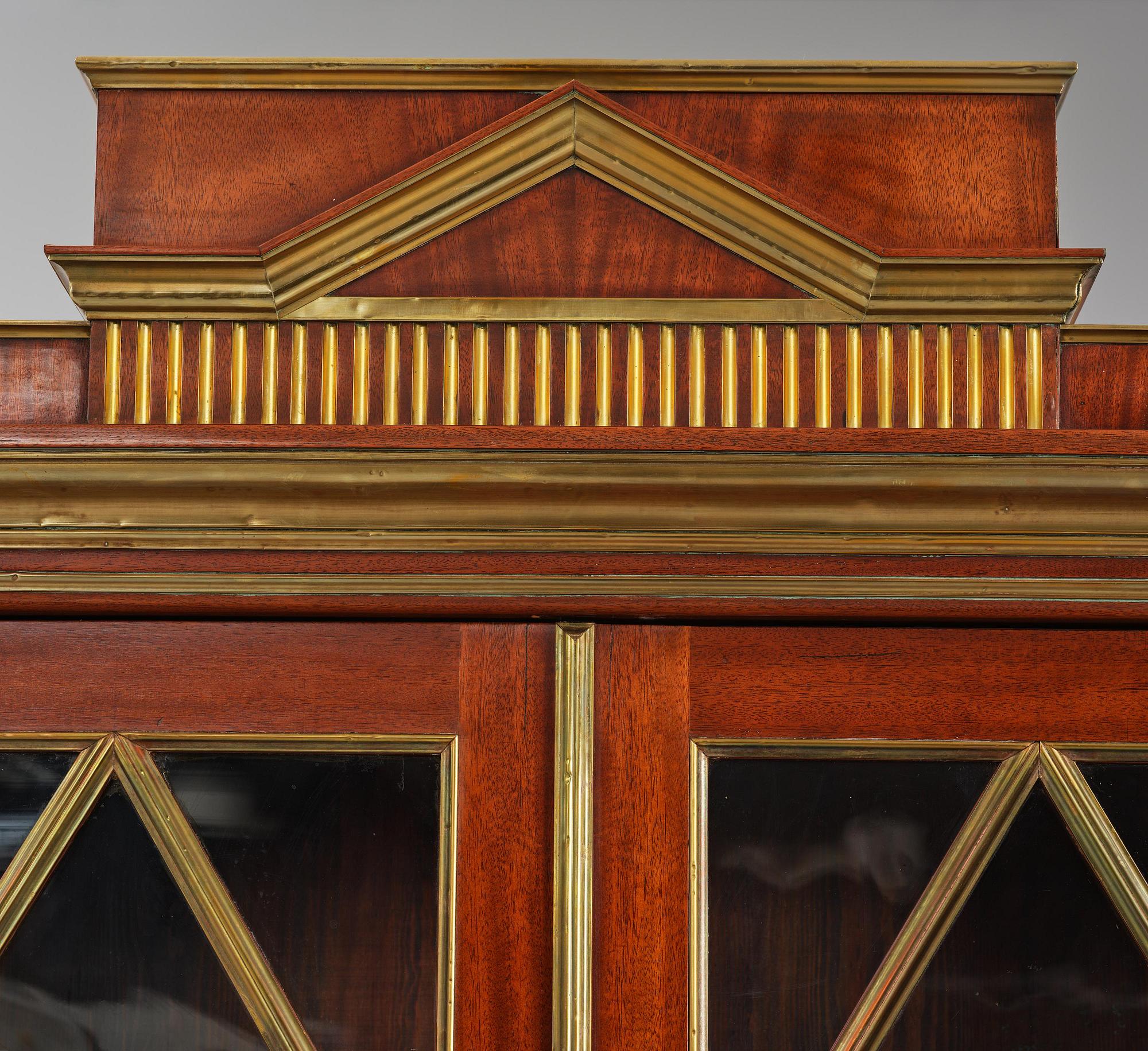 A pair of Russian mahogany and brass-mounted Jacob-style bibliothèques, modern with old parts.