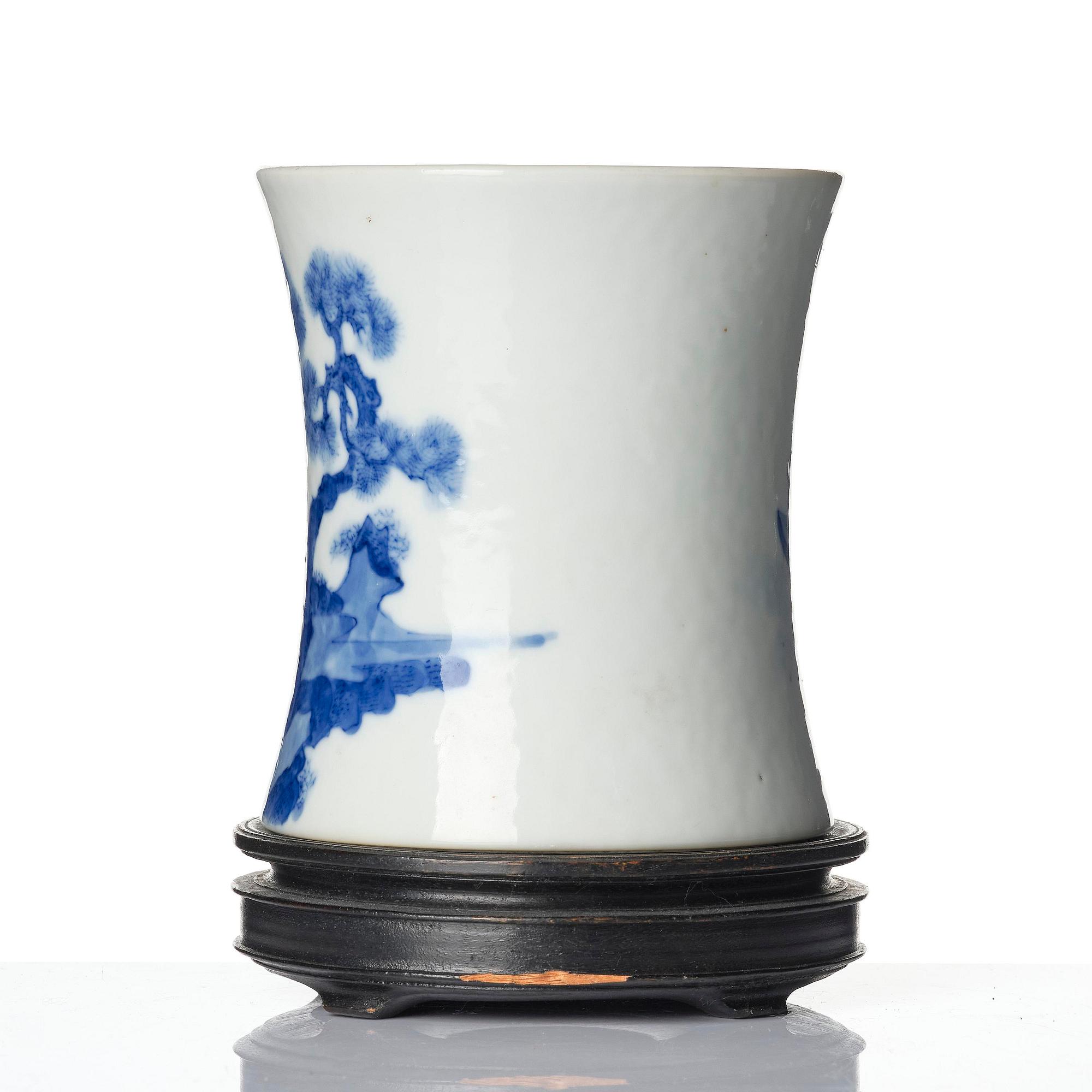 A blue and white brush-pot, bitong, Qing dynasty, 19th century with an apochrypal Kangxi mark.