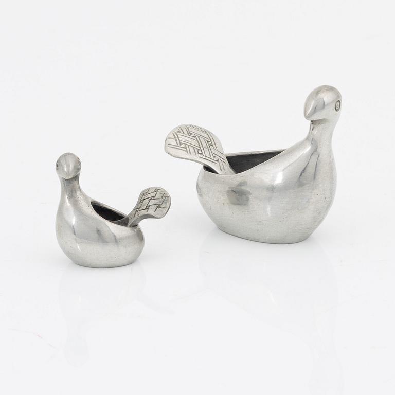 A pair of pewter salt containers by Lars Pirak, signed.