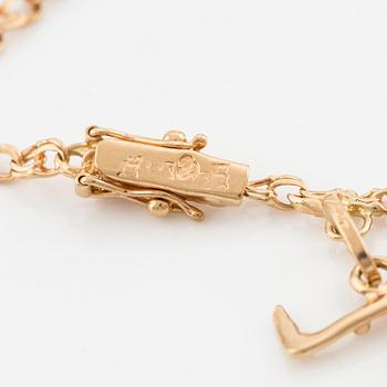 Bracelet, 18K gold with charms.