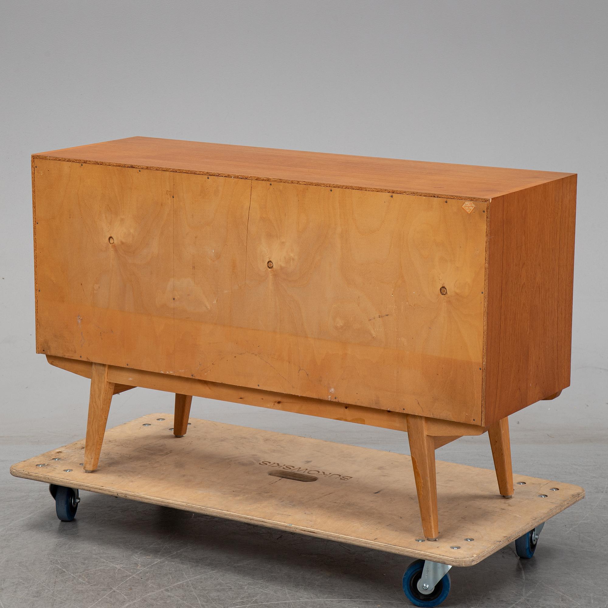 A 1950's teak sideboard.