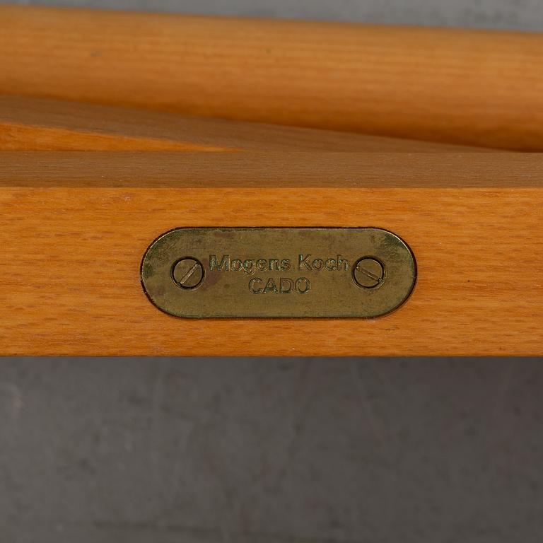 Mogens Koch, a set of four folding chairs, Kado, late 20th century.