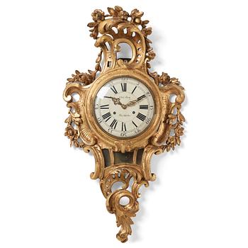 101. A Swedish rococo wall clock by Olof Berg.