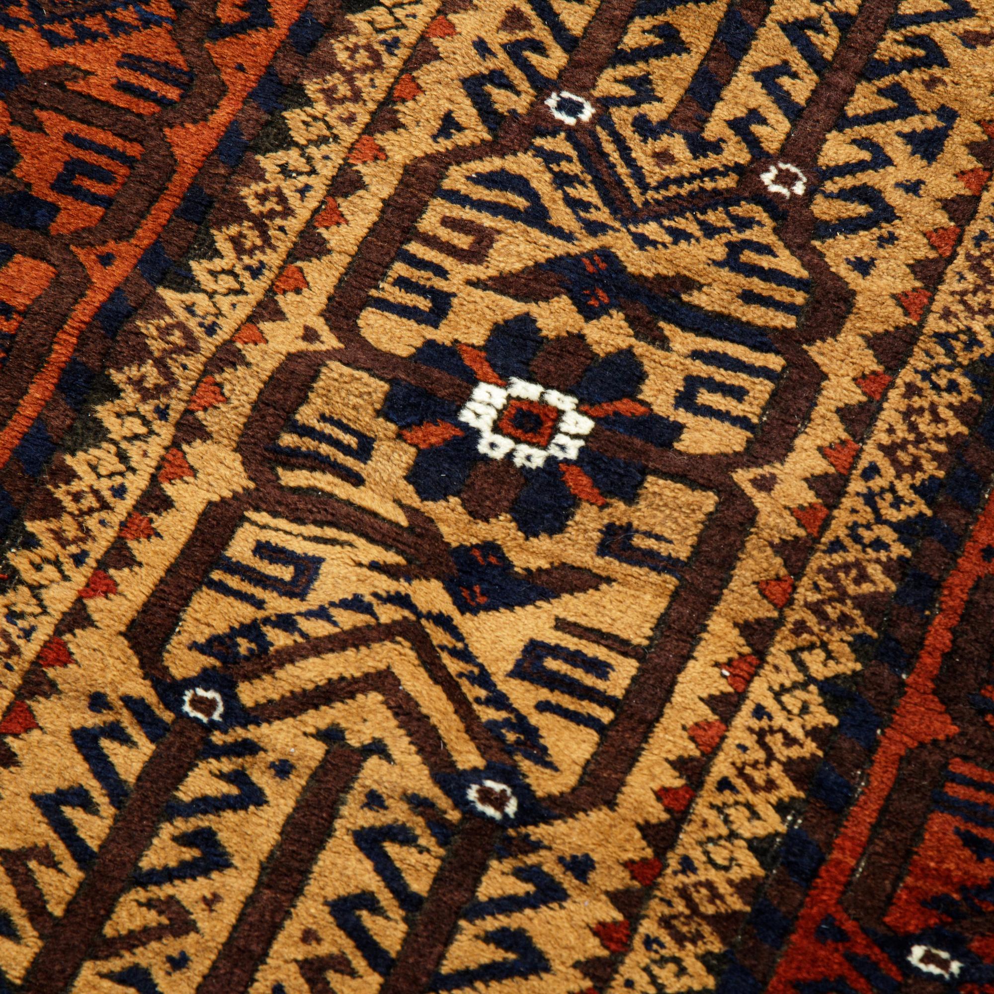 A rug, a semi-antique Baluch, ca 166 x 92 cm.