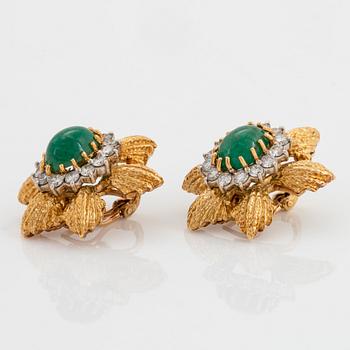 A pair of 18K gold earrings set with cabochon-cut emeralds and round brilliant-cut diamonds.