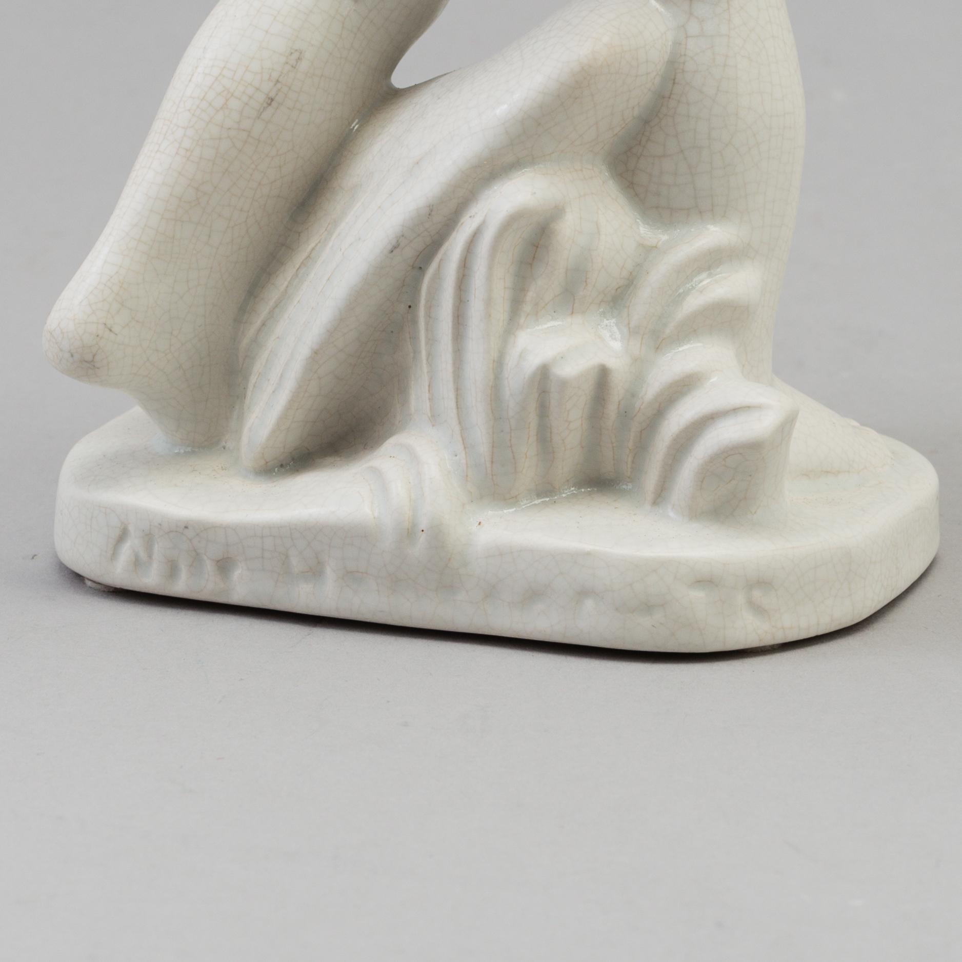 A Nils E. Hansson creamware figure figure, Gefle, Sweden 1936-52.