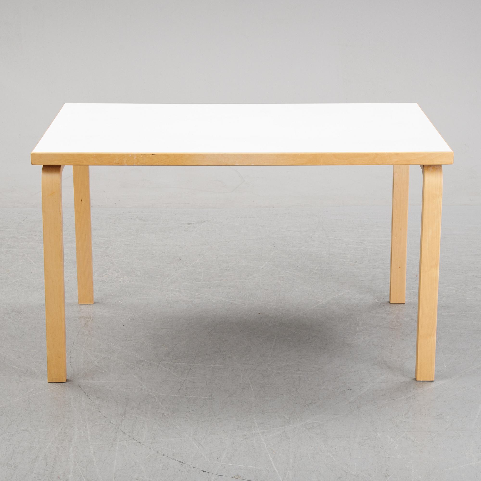 An 'Aalto' table and four chairs model 66 by Alvar Aalto for Artek, designed 1935.