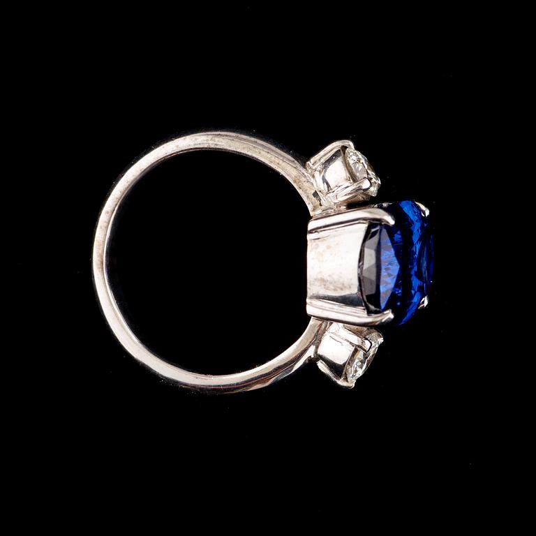 A tanzanite, 8.20 cts, and brilliant-cut diamond ring. Total carat weight of diamonds circa 0.58 ct.