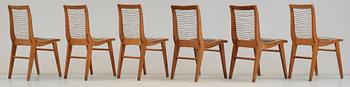 A Louis Sognot set of six ash, metal and rubber chairs, France 1950's.