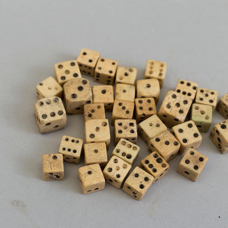 A COLLECTION OF 34 BONE MINIATURE DICE, 19th century.