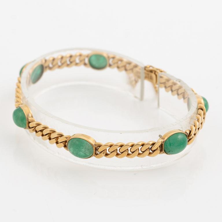 Bracelet in 18K gold with cabochon-cut emeralds, 1920s.