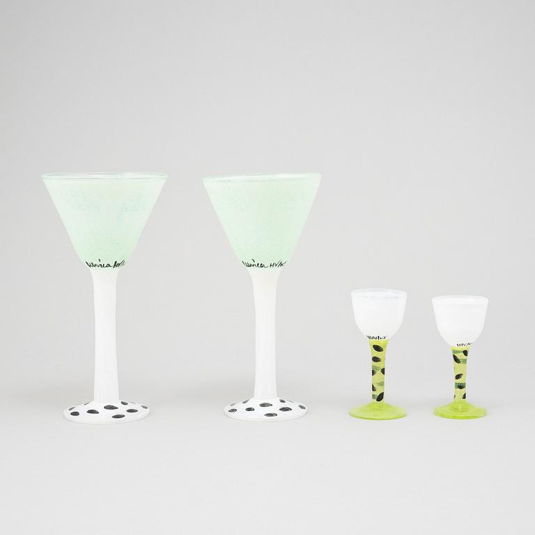 Ulrica Hydman-Vallien, a glass vase, goblet, and six glasses from Kosta Boda, signed and numbered.