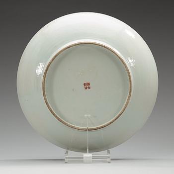 A famille rose dish, China, presumably Republic, 20th Century, with Qianlong four character mark.