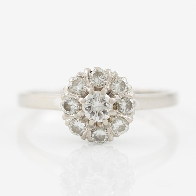 A ring and a pair of earrings in 18K white gold set with round brilliant-cut and octagonal-cut diamonds.