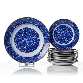 Wilhelm Kåge, 15 creamware dinner plates and a platter, "Fågel Blå", Gustavsberg, Sweden, manufactured 1932-33.