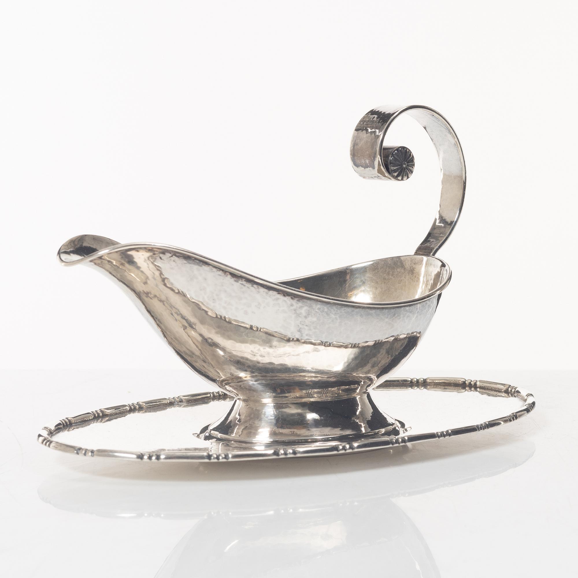 A Swedish silver sauce boat, marks of C.G. Hallberg, Stockholm 1926.