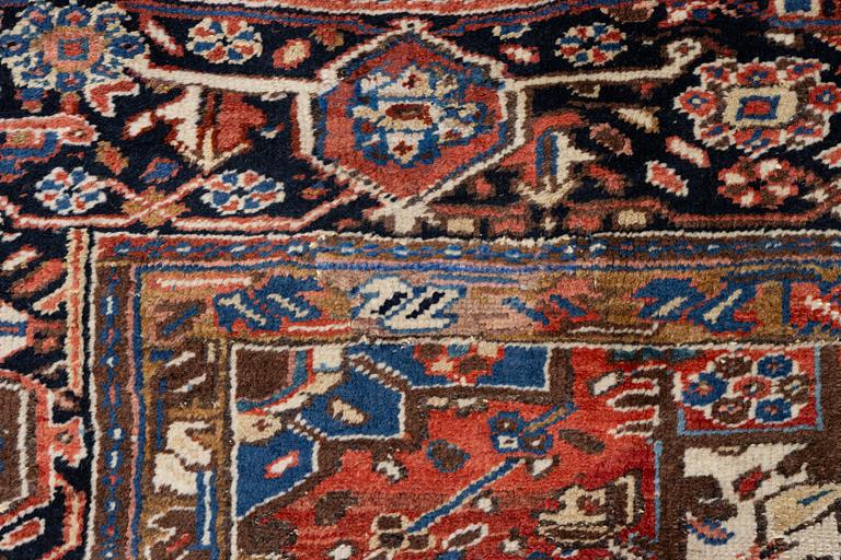 An antique Heriz carpet, west Persia, c. 333 x 238 cm.