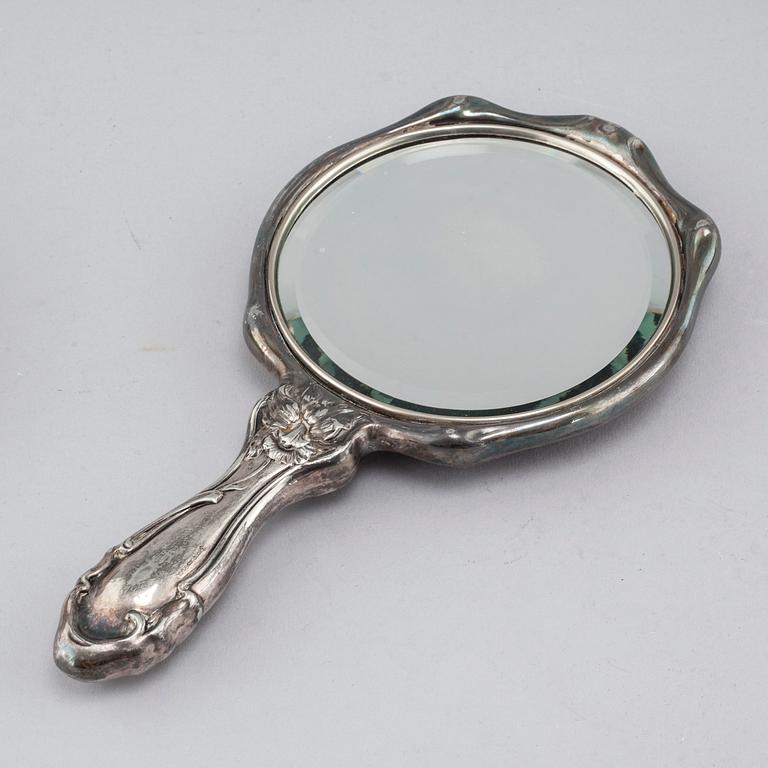 A silverplate toiletrie set, 2 + 4 pcs, early 20th century.