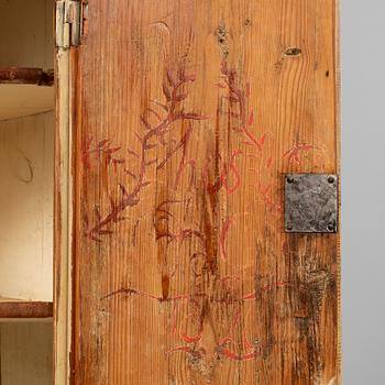 A Swedish late Gustavian corner cabinet in two parts.