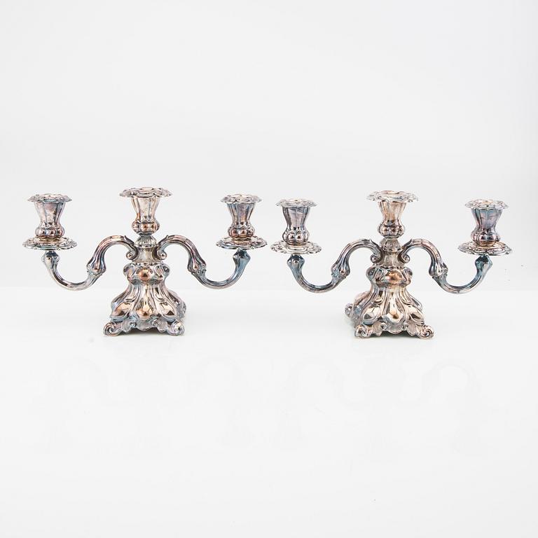 Pair of silver candelabras with Swedish import stamps in rococo style.