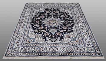 A carpet, Nain, part silk, ca 212 x 153 cm.