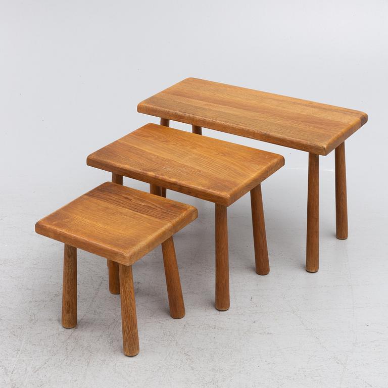 A set of three nesting oak tables or stools. second paert of the 20th century.