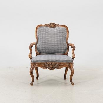 A mid 1700s Rococo armchair.