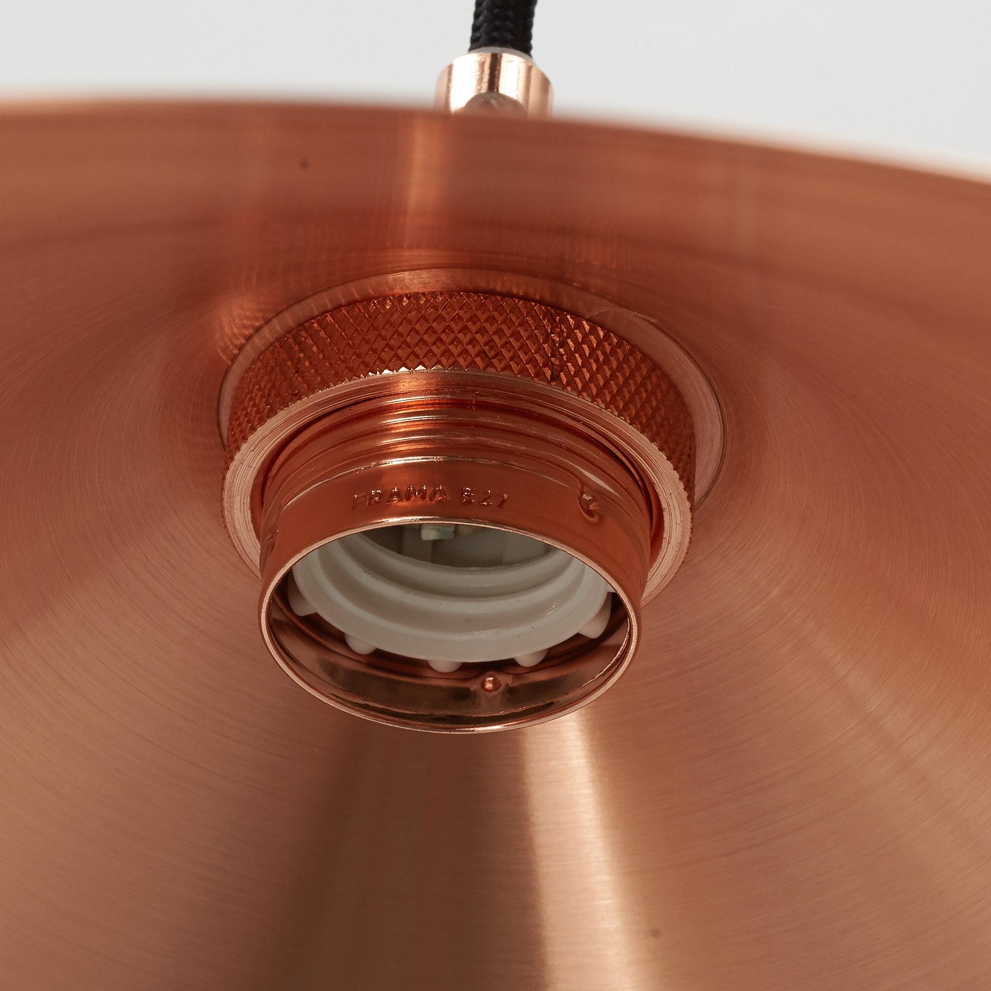 A pair of Frama Shade 360 ceiling lamps.