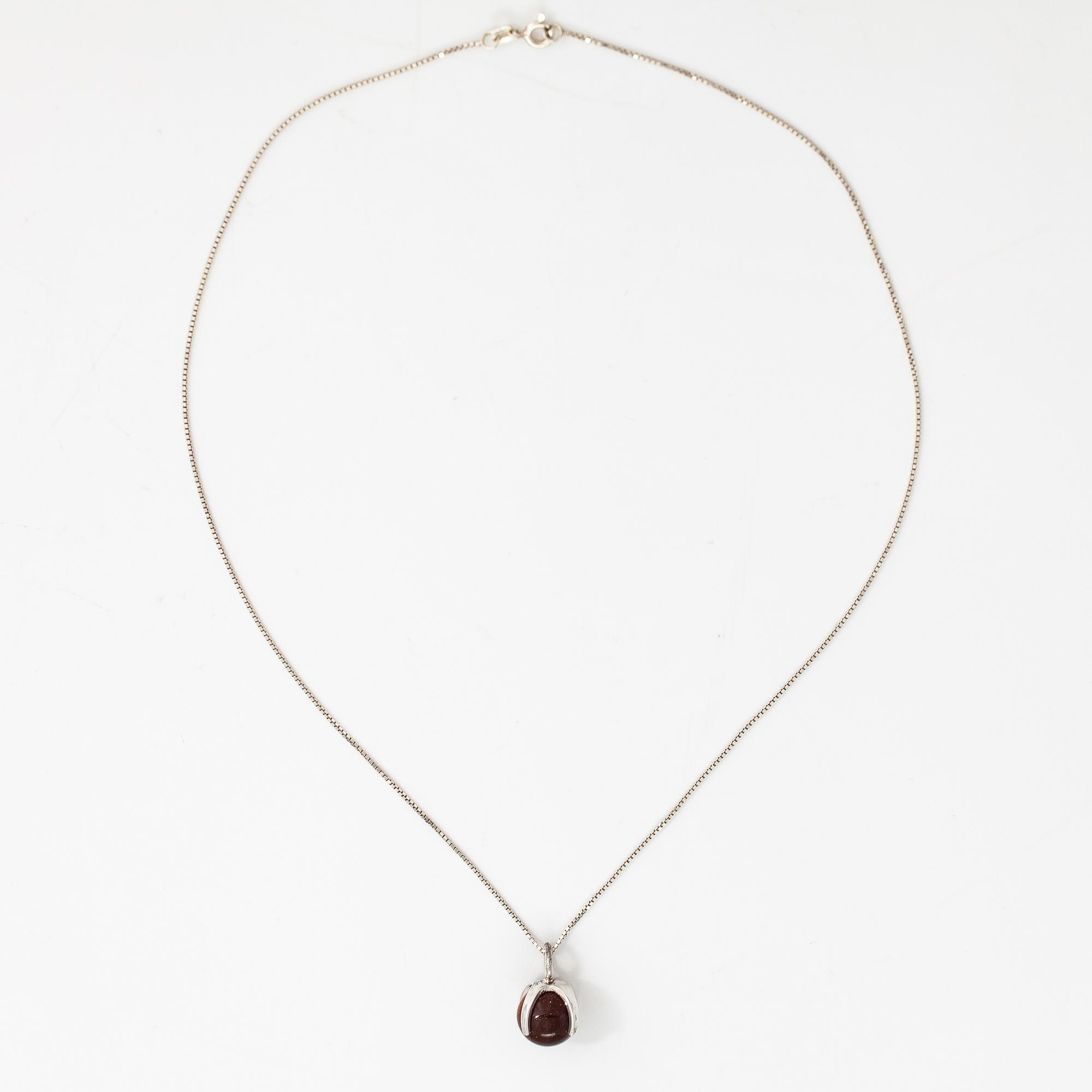 Elis Kauppi, A silver necklace with  a goldstone pearl. Kupittaan kulta, Turku.