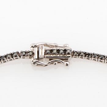 Tennis bracelet 18K white gold with black diamonds.