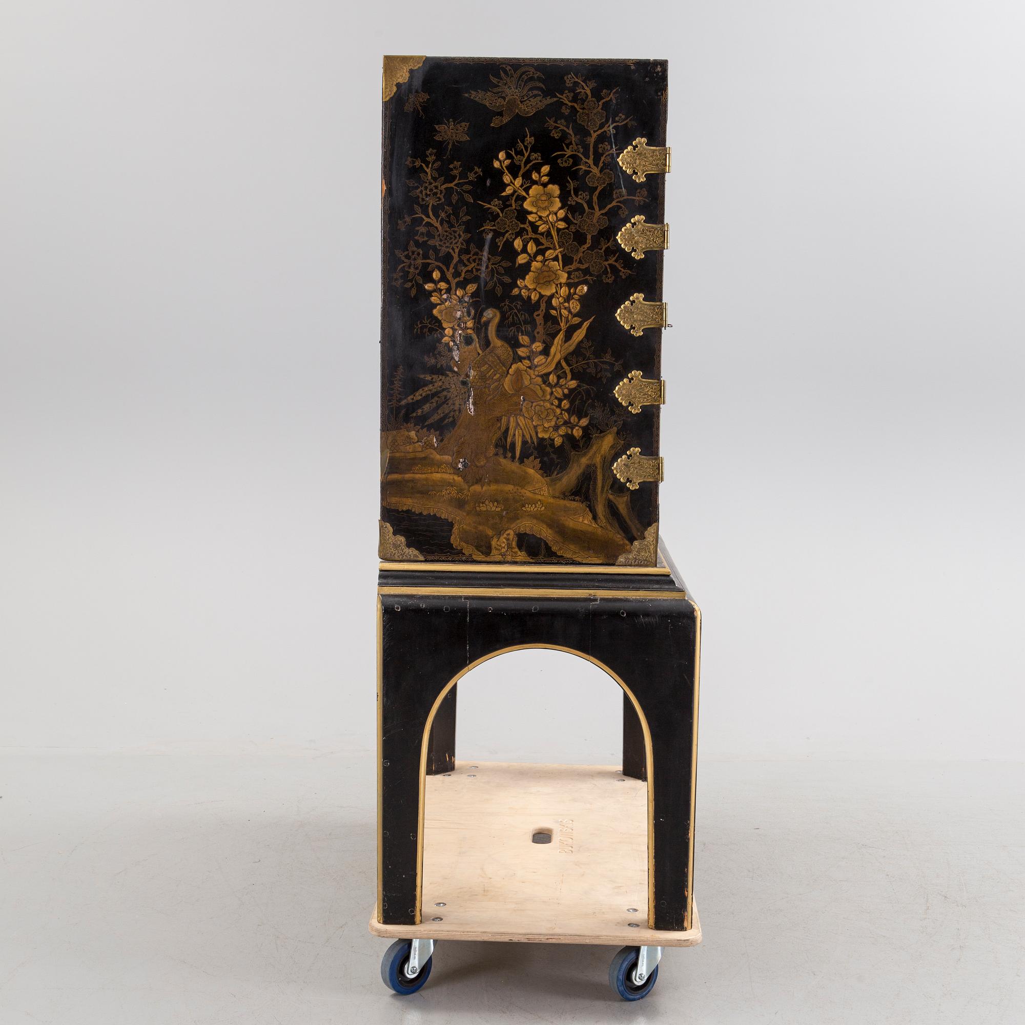 AN early 18TH CENTURY PROBABLY ENGLISH Japanned laquer cabinet on stand.
