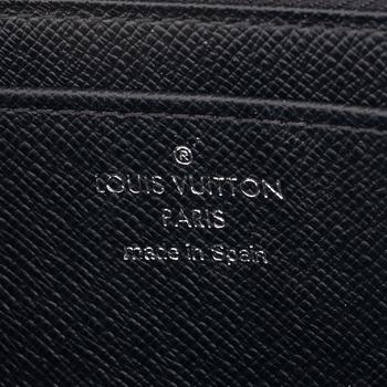 Louis Vuitton, a black Epi wallet, 2015.