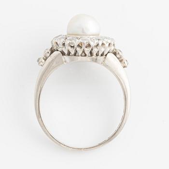 An 18K white gold ring set with a bouton pearl and old-cut diamonds.