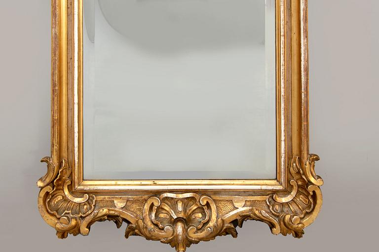 A Swedish Neo Rococo gilded signed mirror 1880s.