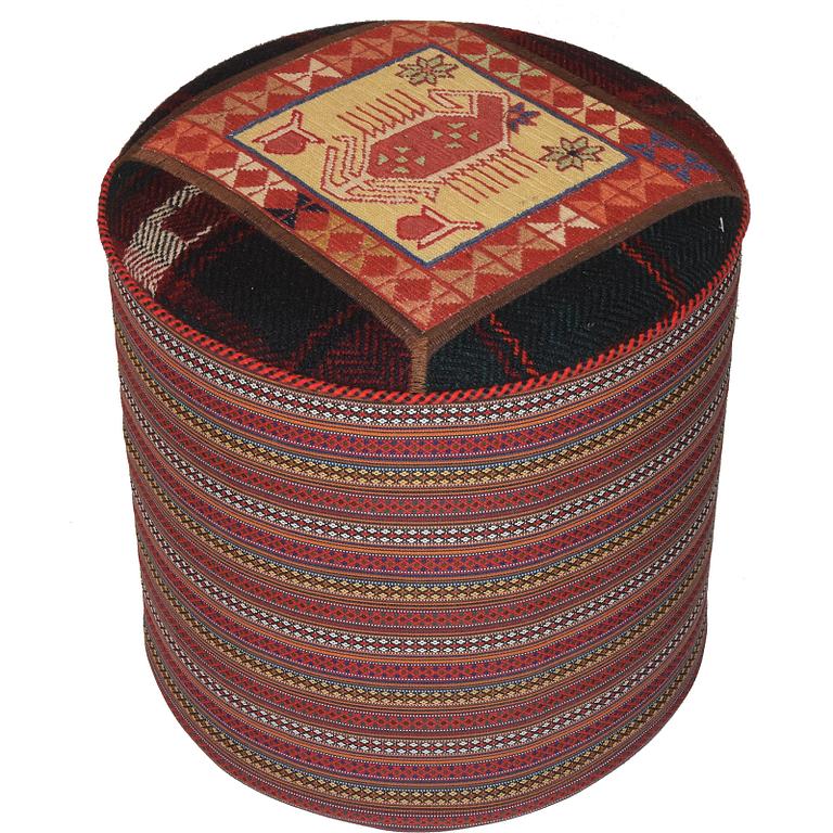 A kilim footstool.