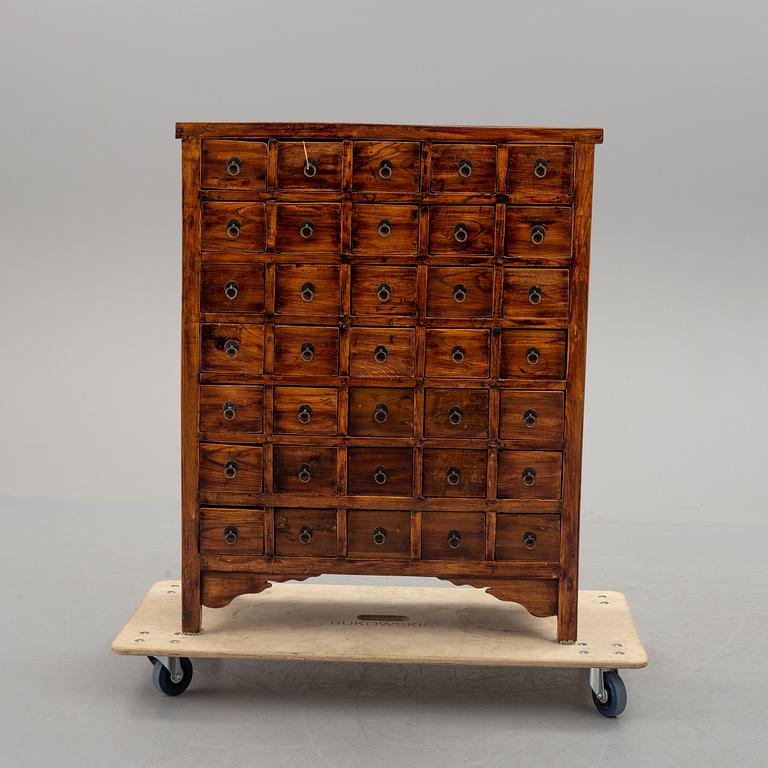 A 19th century Chinese chest of drawers/medicine cabinet.