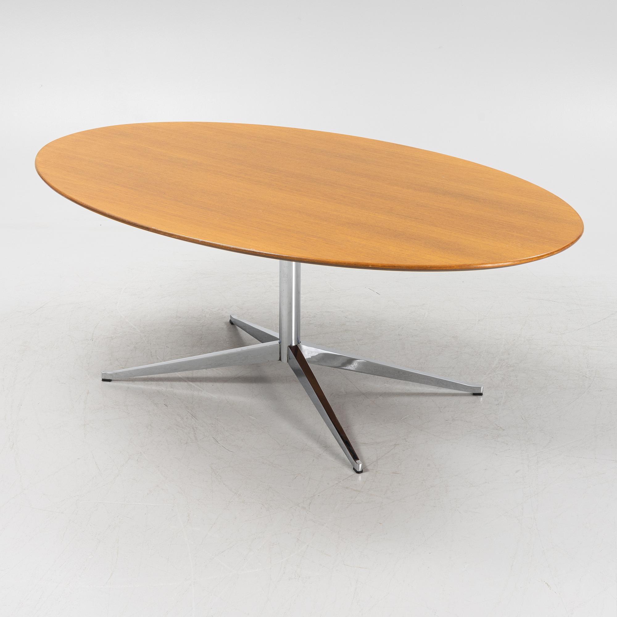 An 'Oval 96' table by Florence Knoll for Knoll International.
