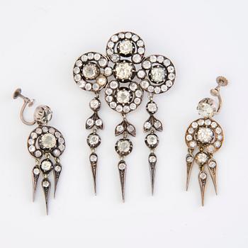 A set of silver earrings and a brooch with glass gems so called "Paste jewelry" Late 19th century.