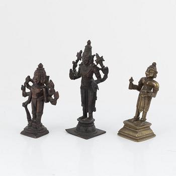 A group of three Indian bronze figures and an ewer, 20th century.